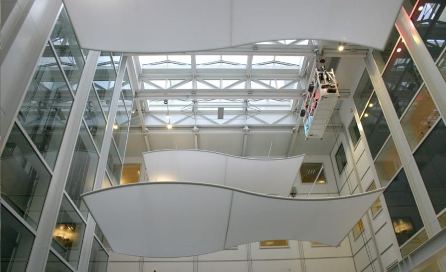 Suspended curved ceiling panels